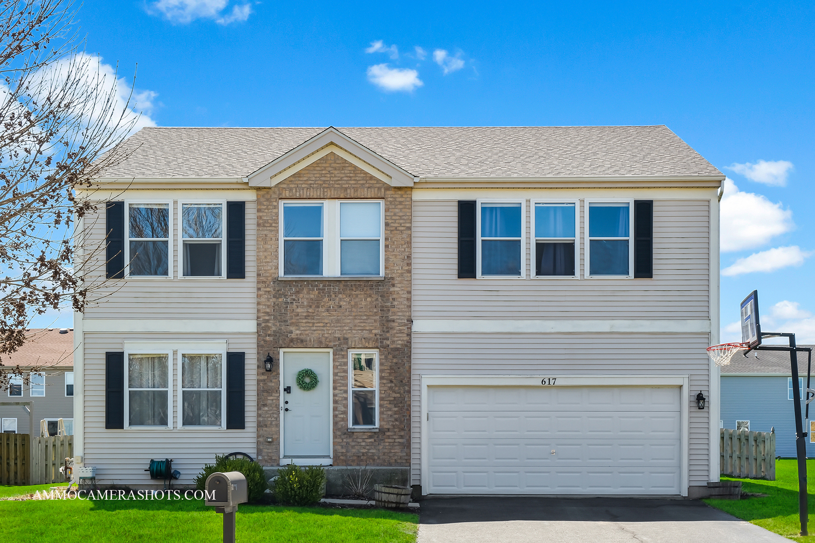 617 Kennedy Street Waterman, IL 60556 - Photo 1 of 32 a front view of a house with a yard