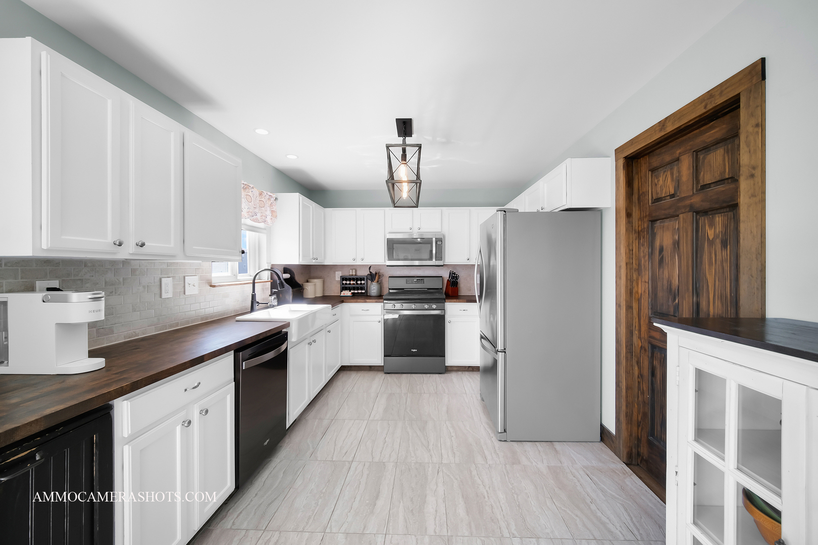 617 Kennedy Street Waterman, IL 60556 - Photo 10 of 32 a kitchen with cabinets wooden floor and stainless steel appliances