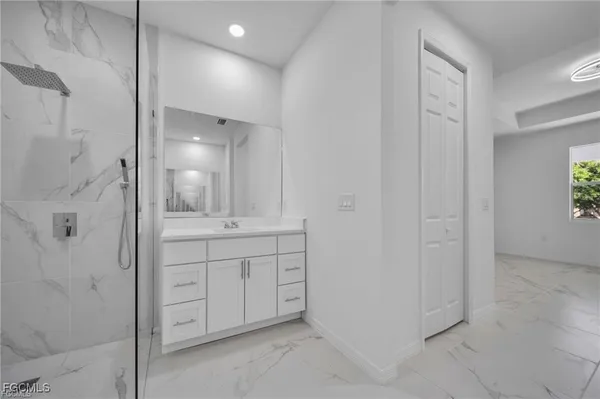 a bathroom with a shower and a sink