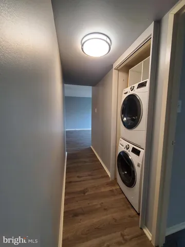 a view of a hallway with washer and dryer