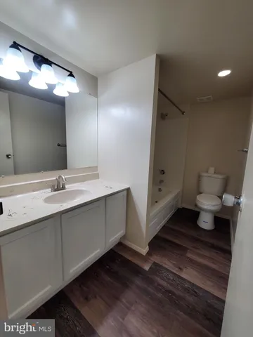 a bathroom with a double vanity sink and mirror