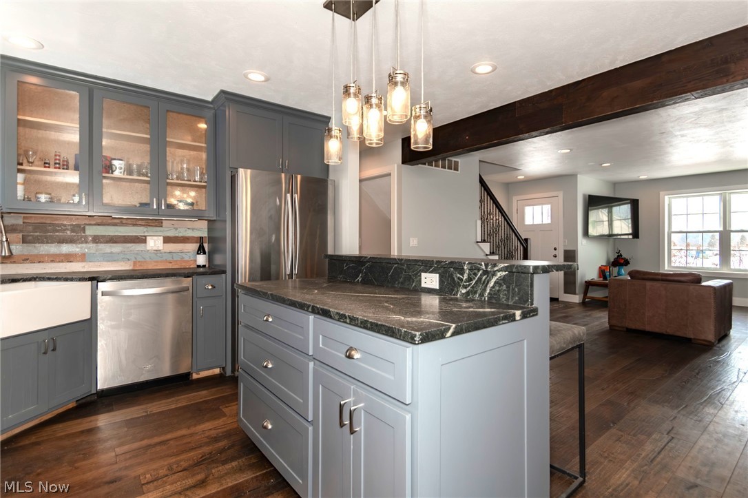 18919 Ravenna Road Chagrin Falls, OH 44023 - Photo 8 of 48 Wood flooring flows seamlessly into the Living
Room with plenty of lighting including pendants above the island and recessed lights bordering the room