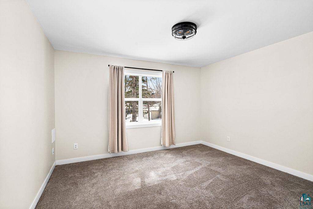 2236 Hoover Street Duluth, MN 55811 - Photo 34 of 52 Carpeted empty room with baseboards