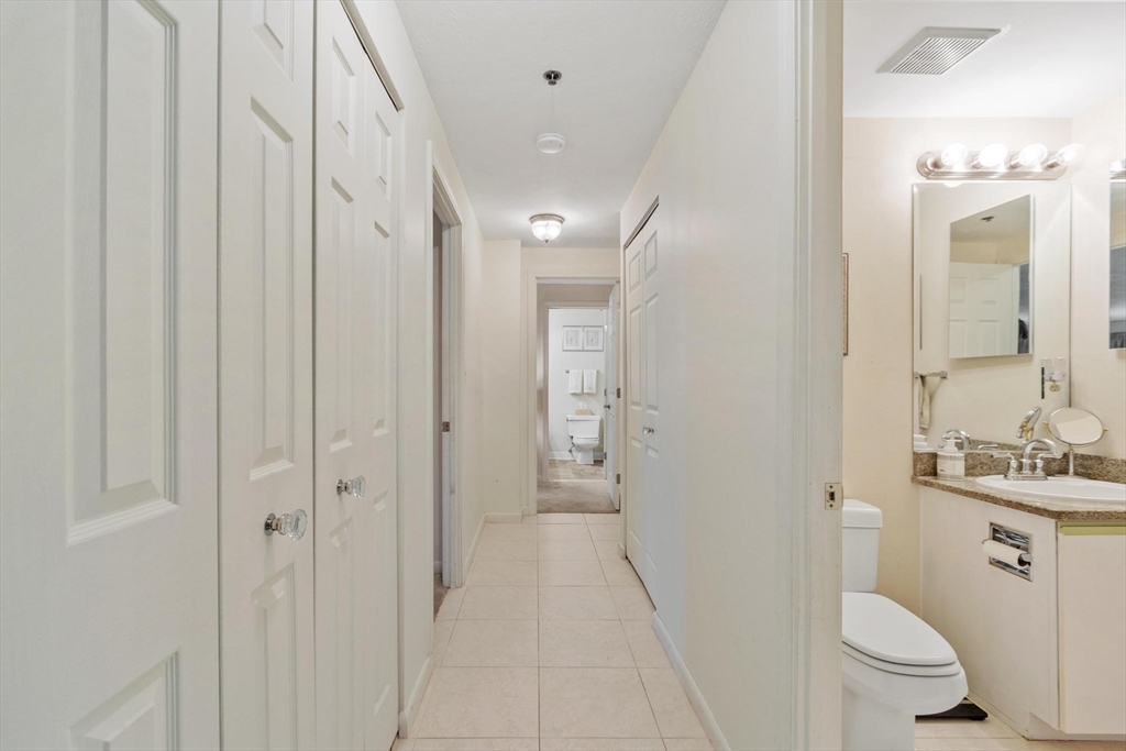 22 Railroad Street, Unit 504 Andover, MA 01810 - Photo 13 of 28 a bathroom with a sink a toilet and shower