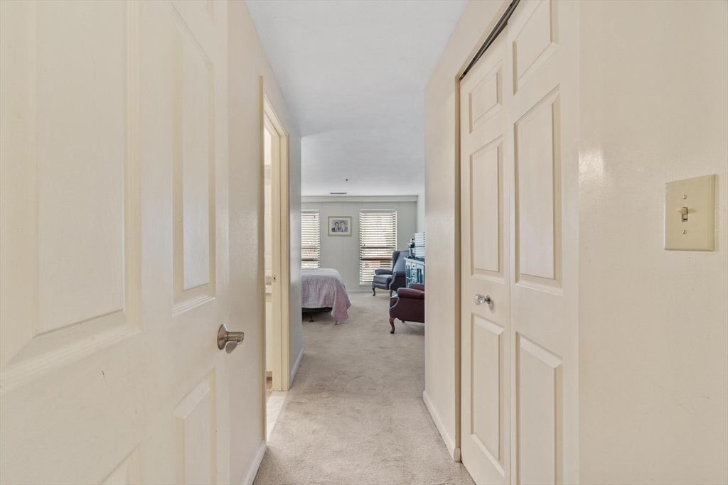 22 Railroad Street, Unit 504 Andover, MA 01810 - Photo 19 of 28 a view of a bedroom from a hallway