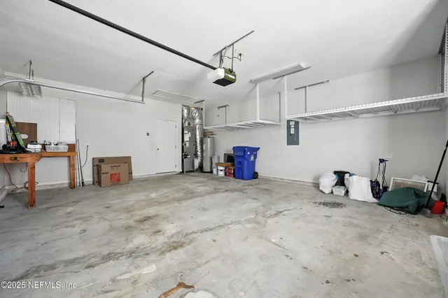 a kitchen with a sink microwave and cabinets