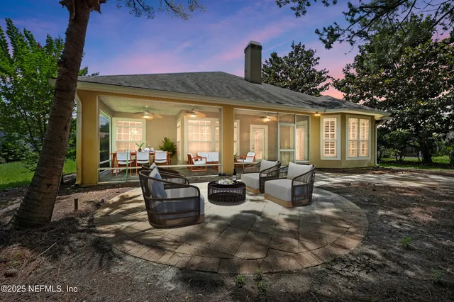 a view of empty room with wooden floor and fireplace