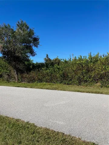 a view of a lake with a yard