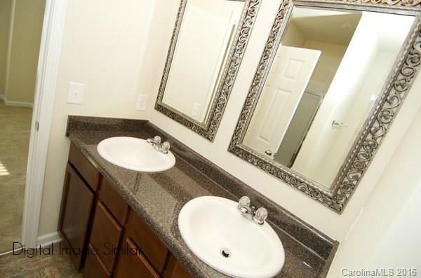 4924 Gibbons Link Road Charlotte, NC 28269 - Photo 1 of 1 a bathroom with a sink and a mirror