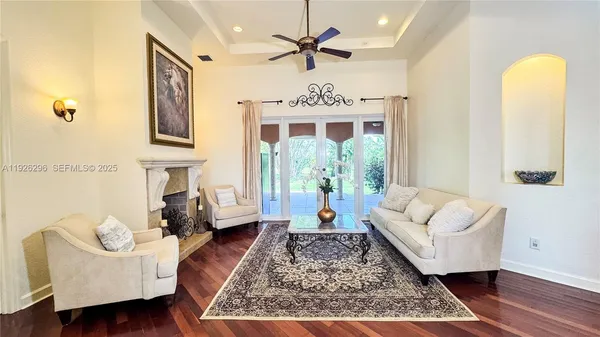a view of a dining room with furniture and chandelier