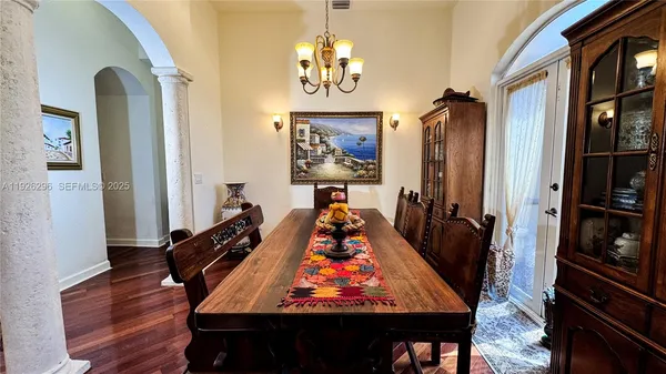 a kitchen with stainless steel appliances granite countertop a sink refrigerator stove and microwave