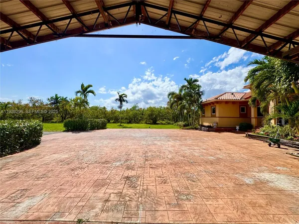 a front view of a house with a yard and a garage