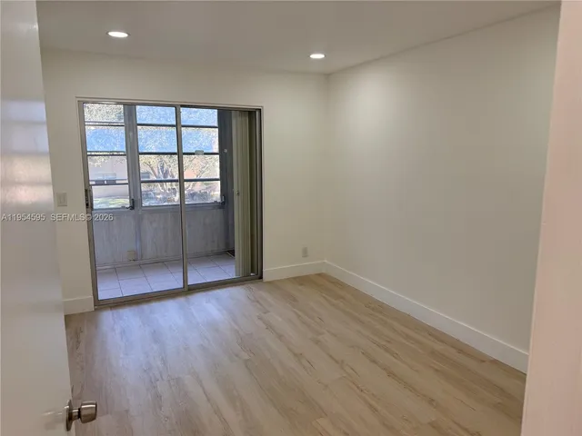 wooden floor and window in an empty room
