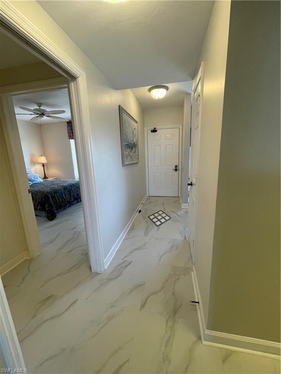 13105 Vanderbilt Drive, Unit 808 Naples, FL 34110 - Photo 22 of 26 a view of a bathroom with a sink