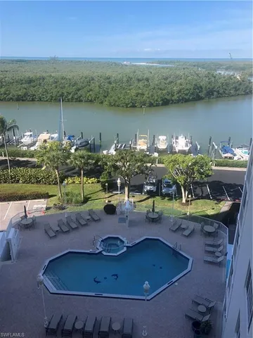 a view of a swimming pool with a patio