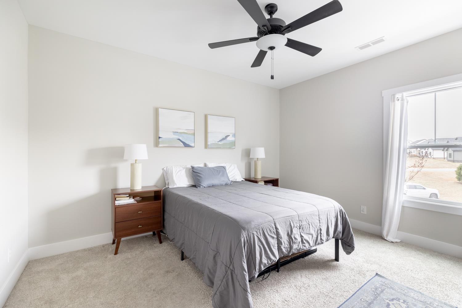 1301 Stoney Ridge Boulevard, Unit 208 Forest, VA 24551 - Photo 23 of 46 a bedroom with a bed and a window