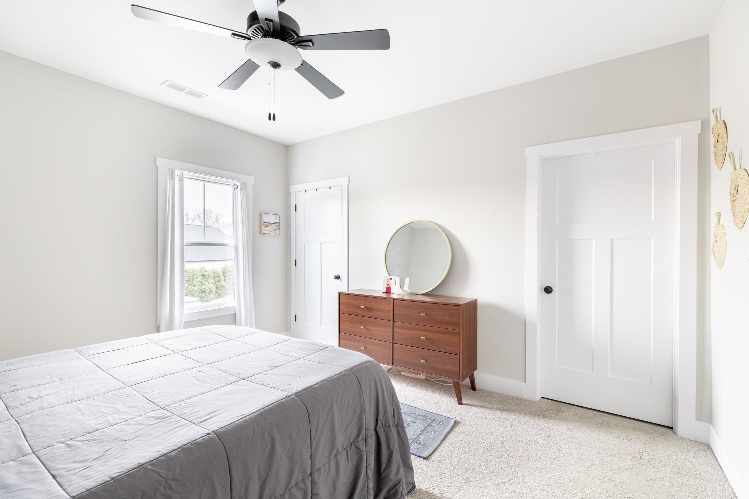 1301 Stoney Ridge Boulevard, Unit 208 Forest, VA 24551 - Photo 25 of 46 a bedroom with a bed and a chandelier