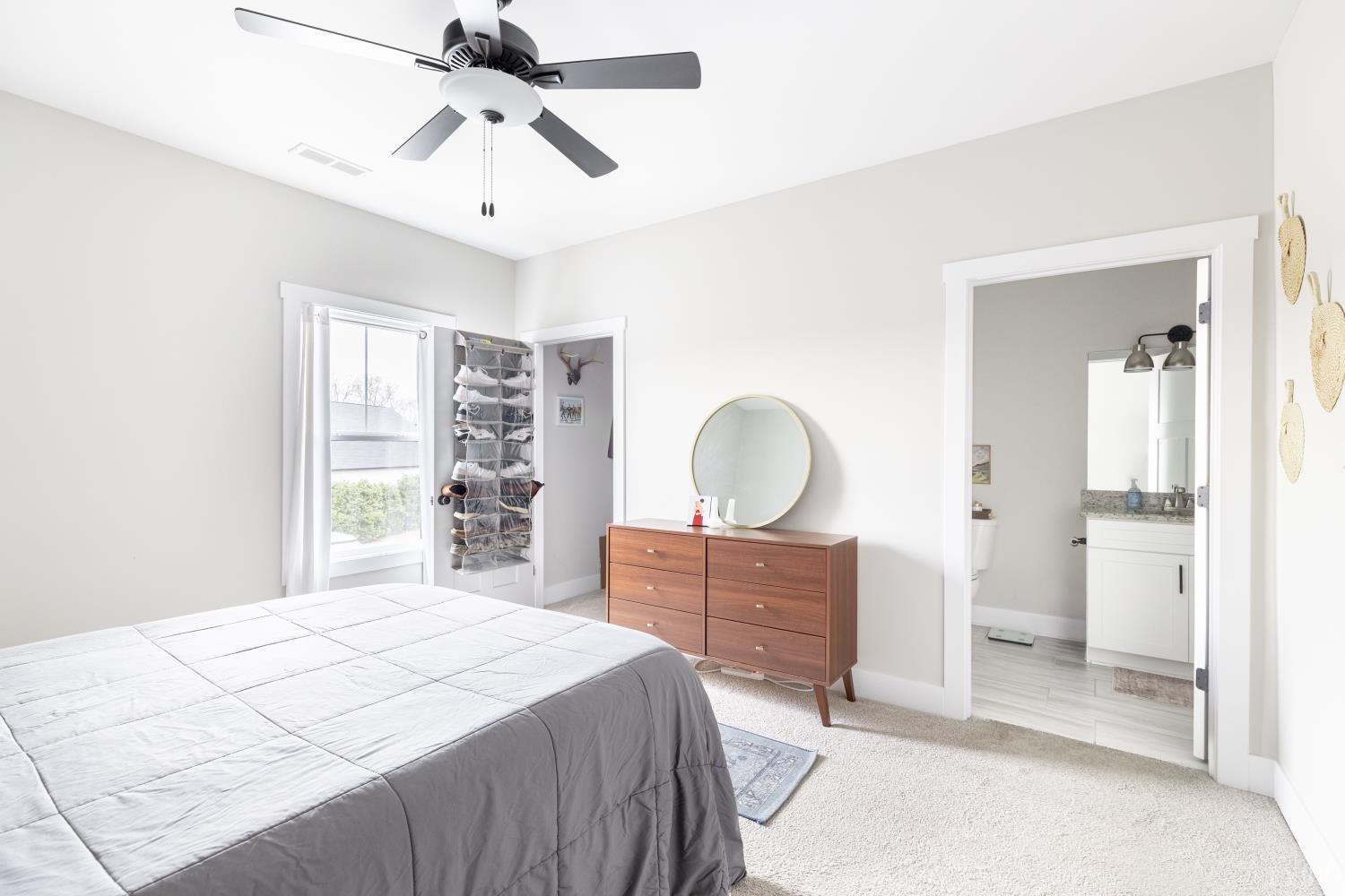 1301 Stoney Ridge Boulevard, Unit 208 Forest, VA 24551 - Photo 26 of 46 a bedroom with a bed and a chandelier