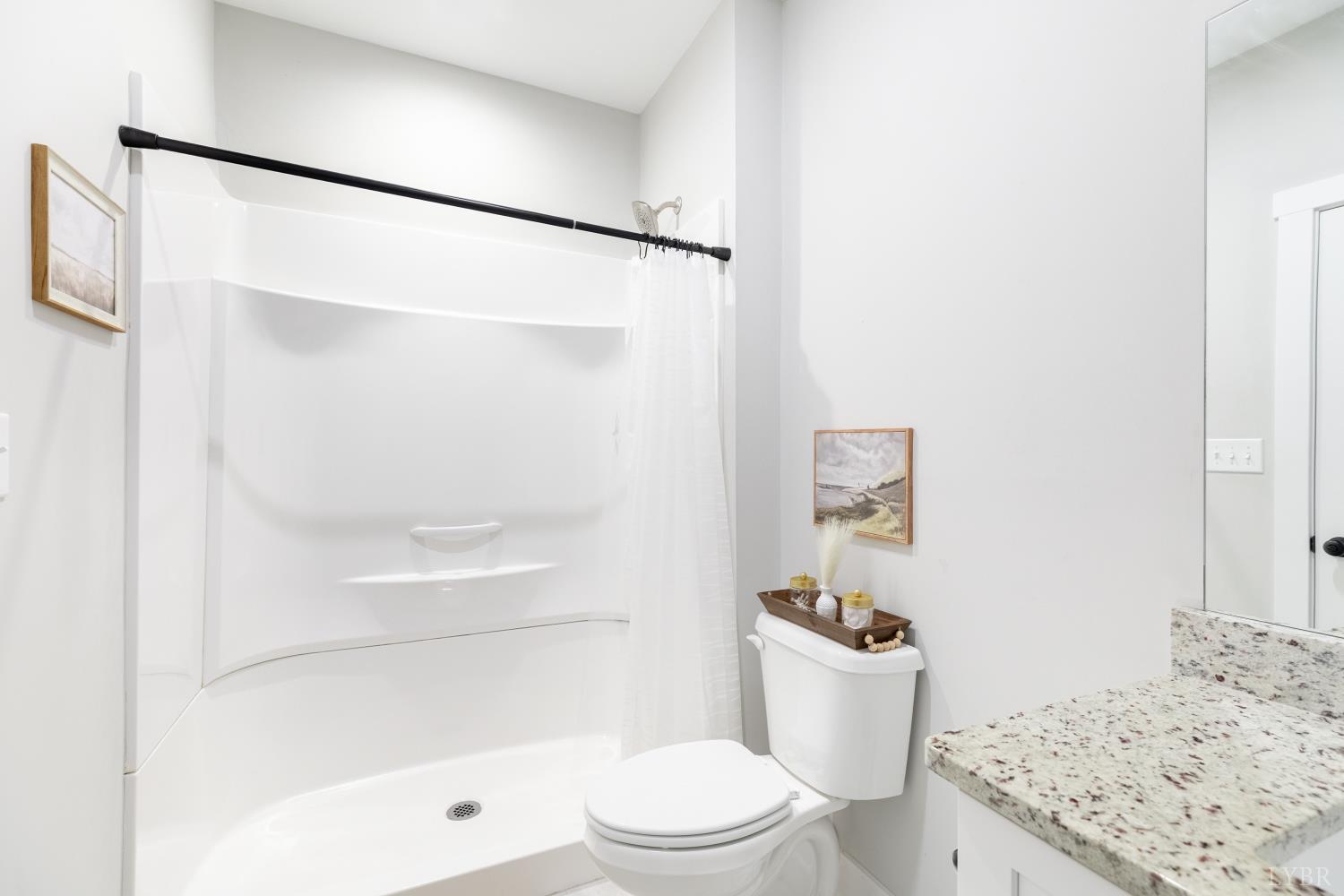 1301 Stoney Ridge Boulevard, Unit 208 Forest, VA 24551 - Photo 28 of 46 a bathroom with a sink a toilet and shower
