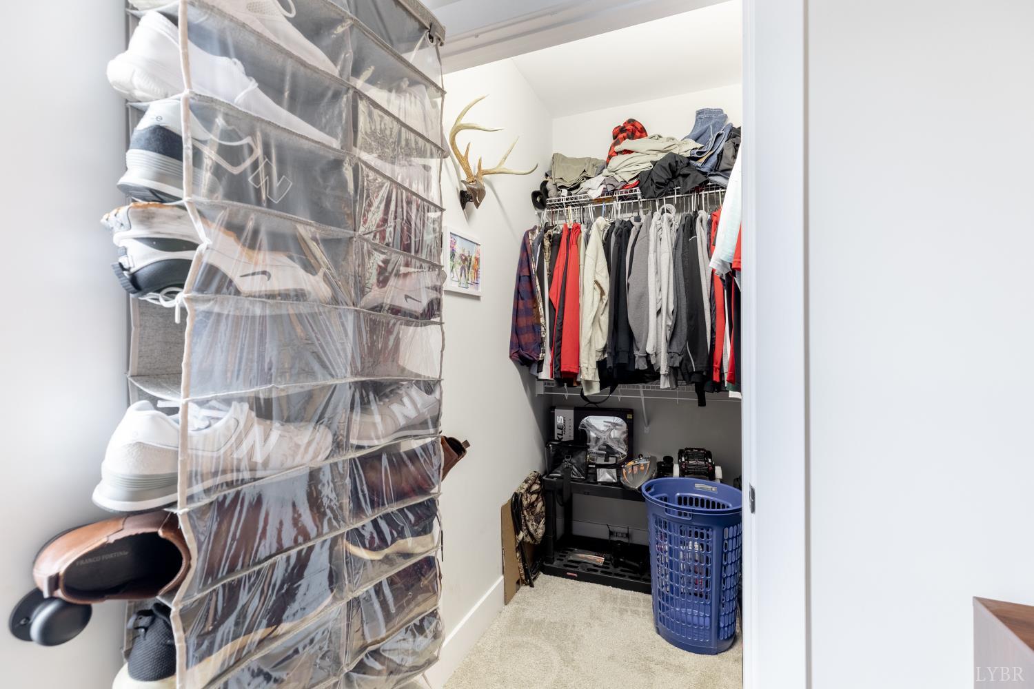 1301 Stoney Ridge Boulevard, Unit 208 Forest, VA 24551 - Photo 29 of 46 a view of walk in closet with clothes and shoes