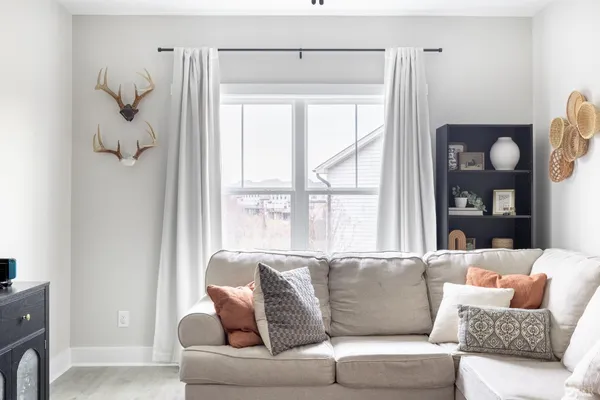 a living room with furniture and a window