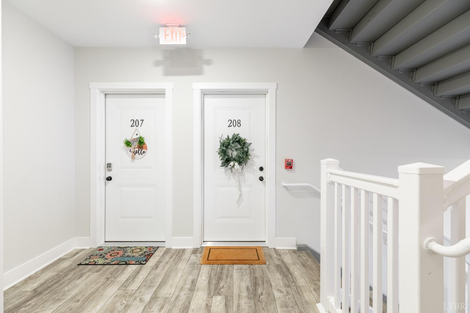 1301 Stoney Ridge Boulevard, Unit 208 Forest, VA 24551 - Photo 4 of 46 a view of a hallway with wooden floor and entryway