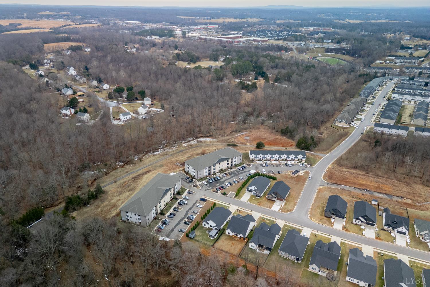 1301 Stoney Ridge Boulevard, Unit 208 Forest, VA 24551 - Photo 42 of 46 an aerial view of a city with lots of residential buildings