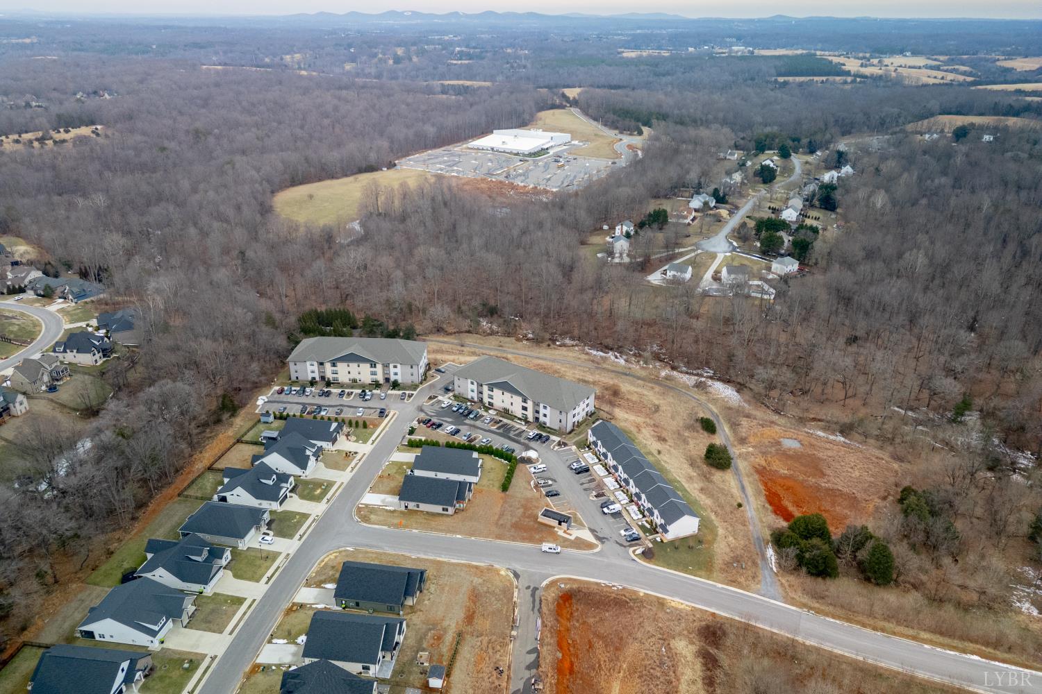 1301 Stoney Ridge Boulevard, Unit 208 Forest, VA 24551 - Photo 43 of 46 an aerial view of a residential apartment building with outdoor space