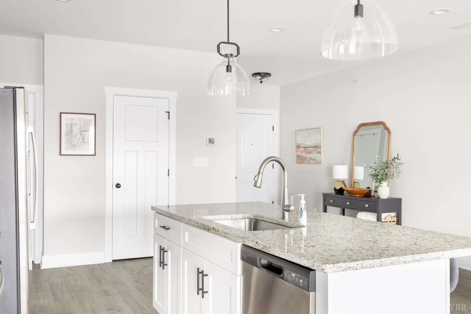 1301 Stoney Ridge Boulevard, Unit 208 Forest, VA 24551 - Photo 9 of 46 a kitchen with sink and chandelier