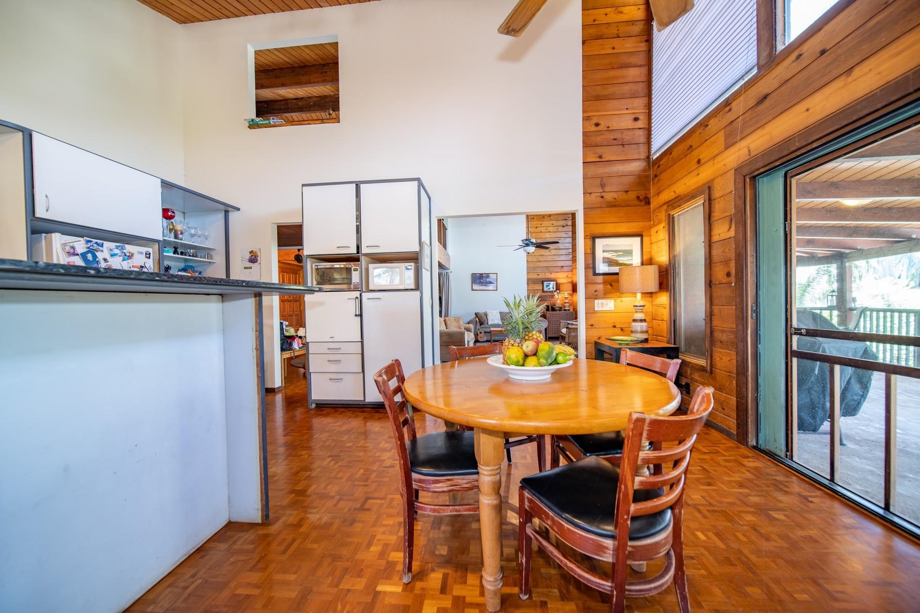 590 Stable Road, Unit C & D Paia, HI 96779 - Photo 21 of 30 a dining room with furniture and a kitchen view