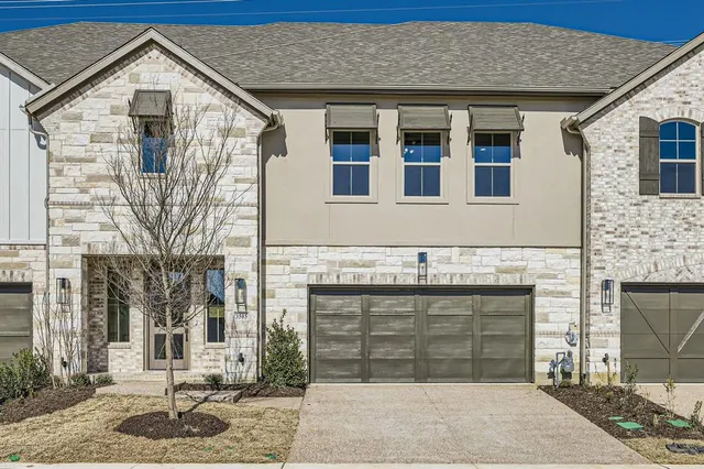 a front view of a house with parking