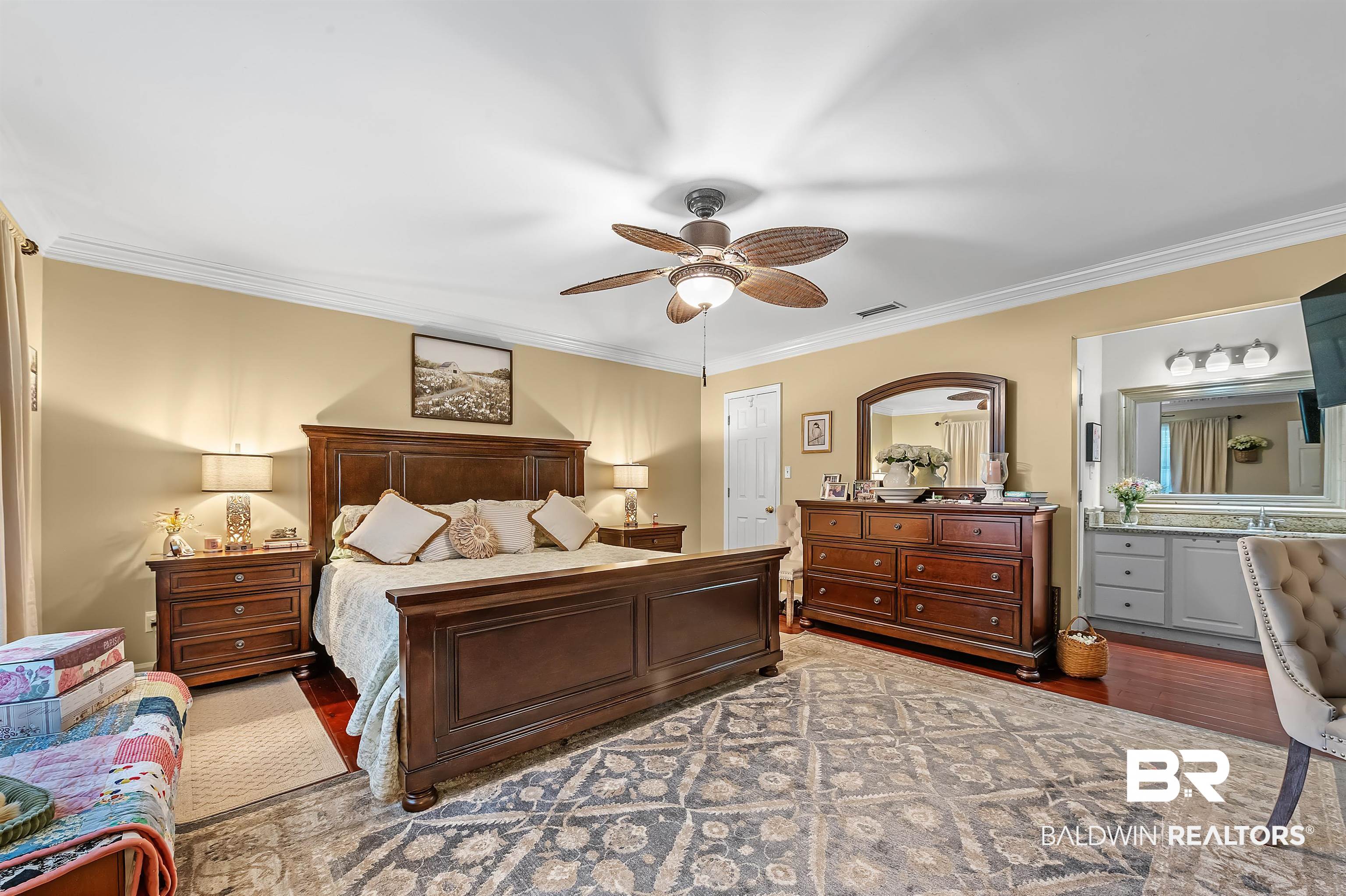 9901 Glover Court Fairhope, AL 36532 - Photo 17 of 52 Bedroom featuring ceiling fan, ornamental molding, and hardwood / wood-style floors