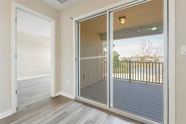 a view of a glass door and the porch