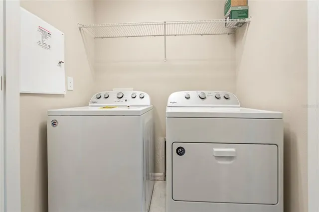 a utility room with dryer and washer