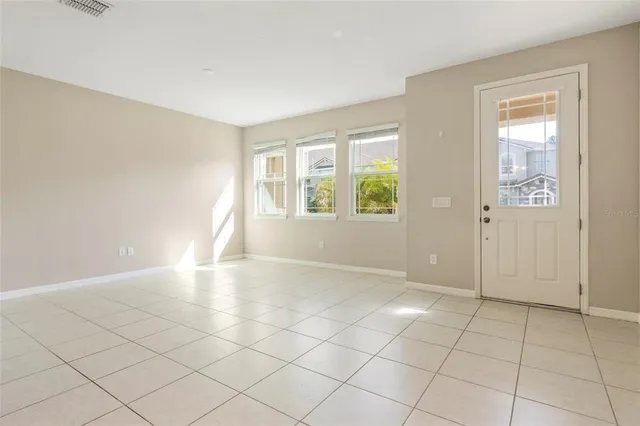 an empty room with windows and closet