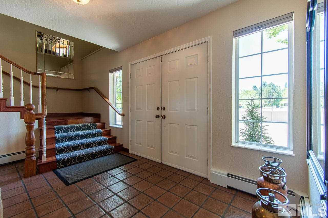 1155 Yates Lane Reno, NV 89509 - Photo 3 of 25 a view of entryway with stairs and a window
