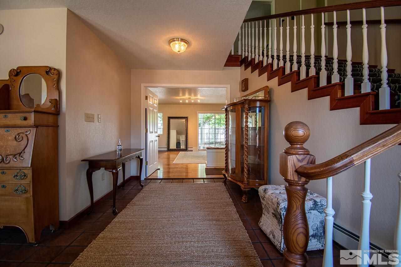 1155 Yates Lane Reno, NV 89509 - Photo 4 of 25 a view of a hallway with paintings on the walls
