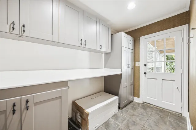 a view of a patio with table and chairs and wooden floor