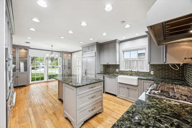 a kitchen with granite countertop lots of counter top space and stainless steel appliances