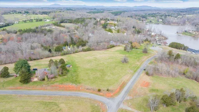 a view of a swimming pool with a yard