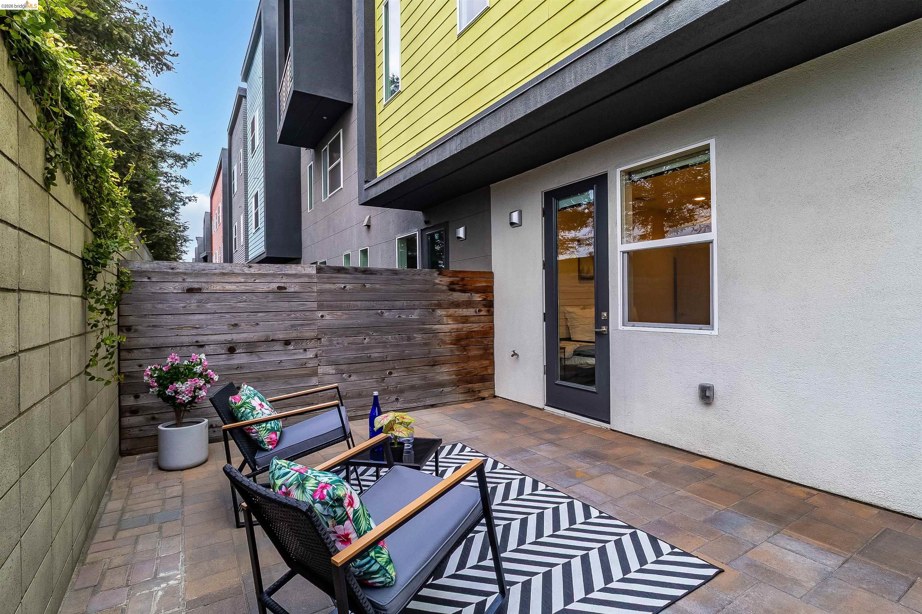 1357 Pullman Way Oakland, CA 94607 - Photo 33 of 37 Private outdoor patio space featuring paver flooring and a natural wood-finish privacy wall