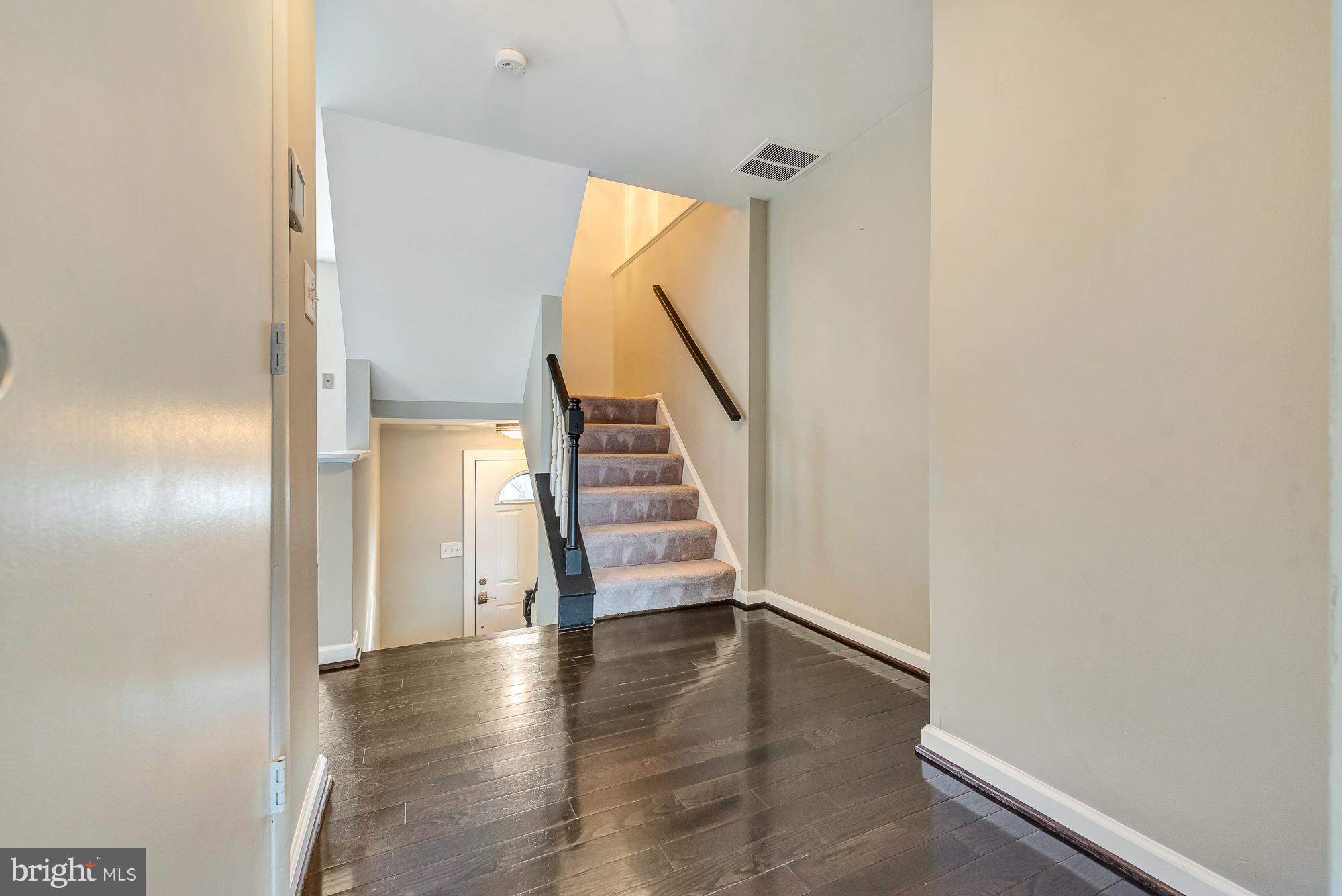17624 Kohlhoss Road Poolesville, MD 20837 - Photo 13 of 36 a view of a hallway with wooden floor and entryway