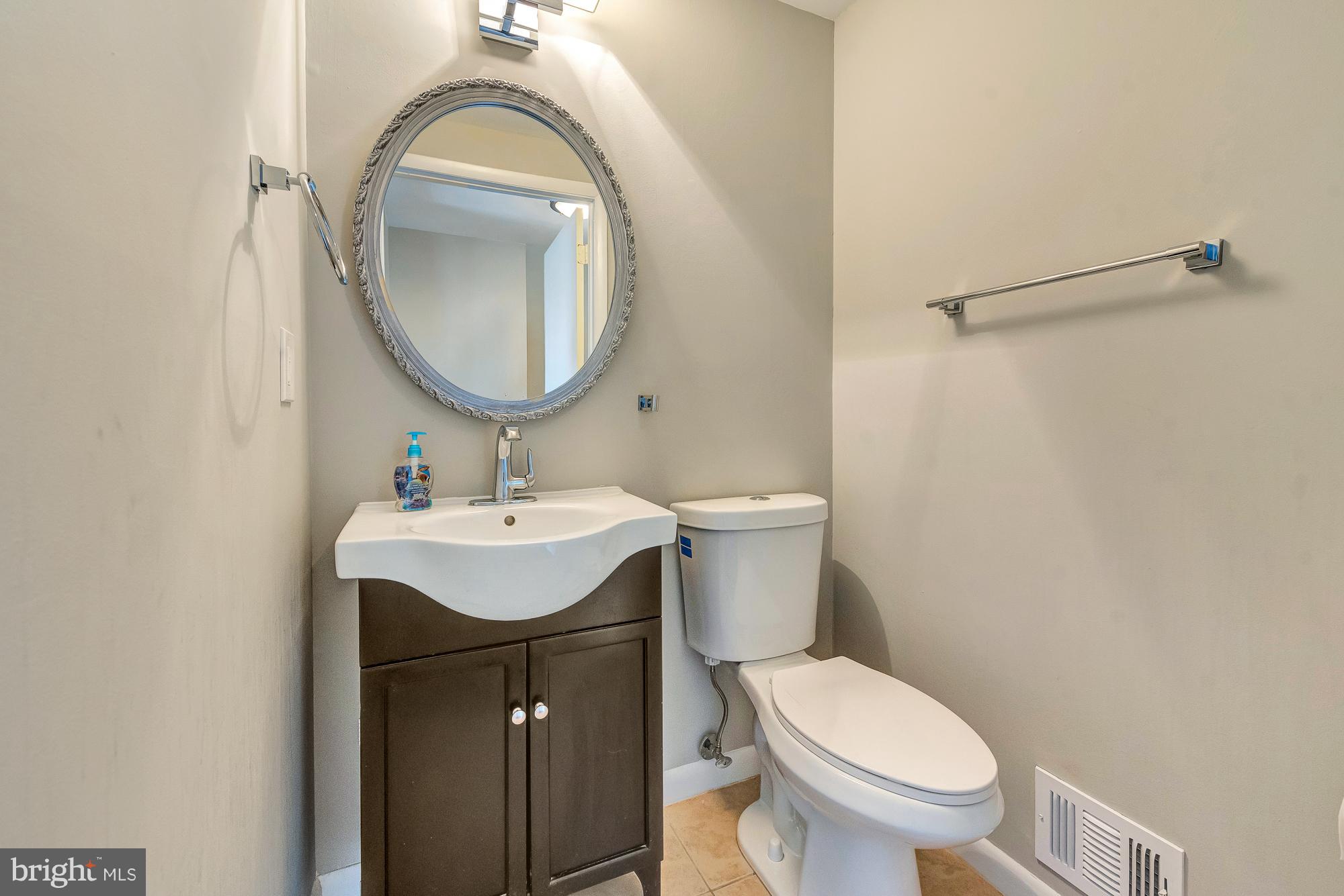 17624 Kohlhoss Road Poolesville, MD 20837 - Photo 14 of 36 a bathroom with a toilet a sink and a mirror