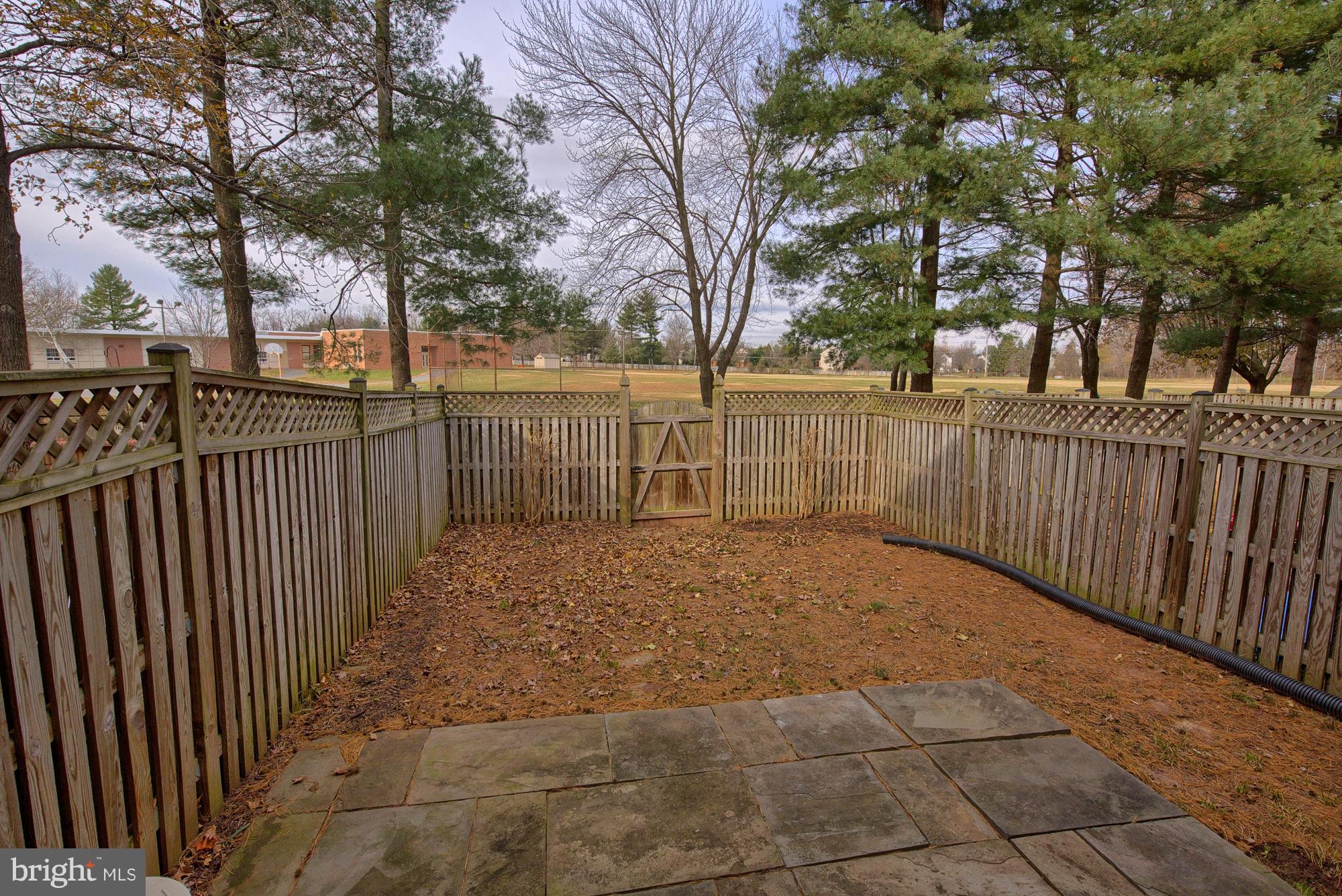 17624 Kohlhoss Road Poolesville, MD 20837 - Photo 3 of 36 a view of a yard with trees and wooden fence