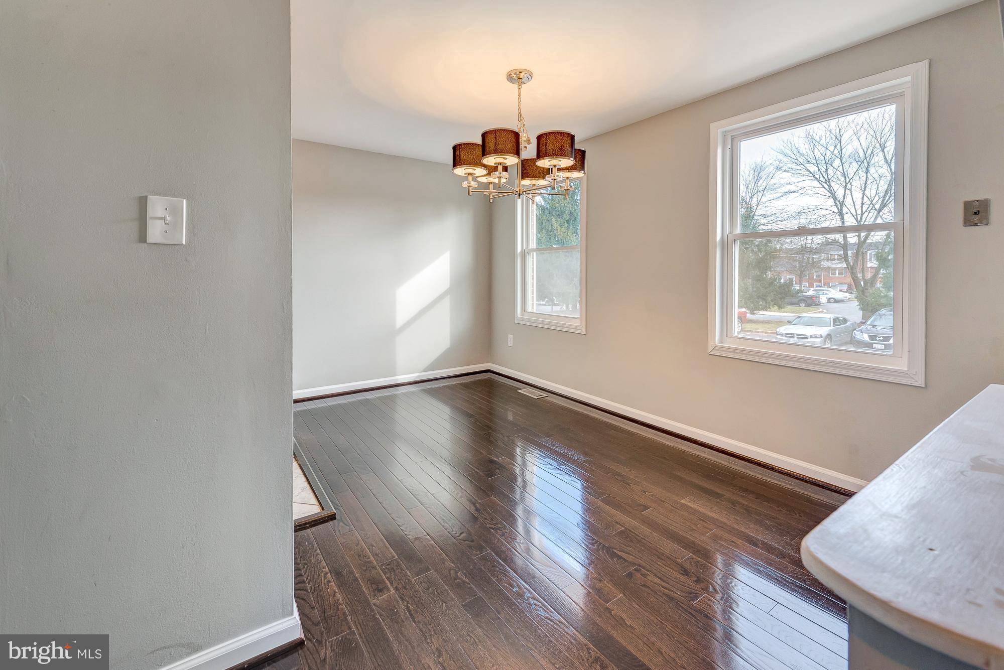 17624 Kohlhoss Road Poolesville, MD 20837 - Photo 8 of 36 a view of a room with wooden floor and chandelier