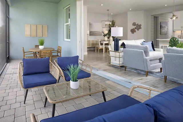 a view of a patio with table and chairs potted plants with lake view