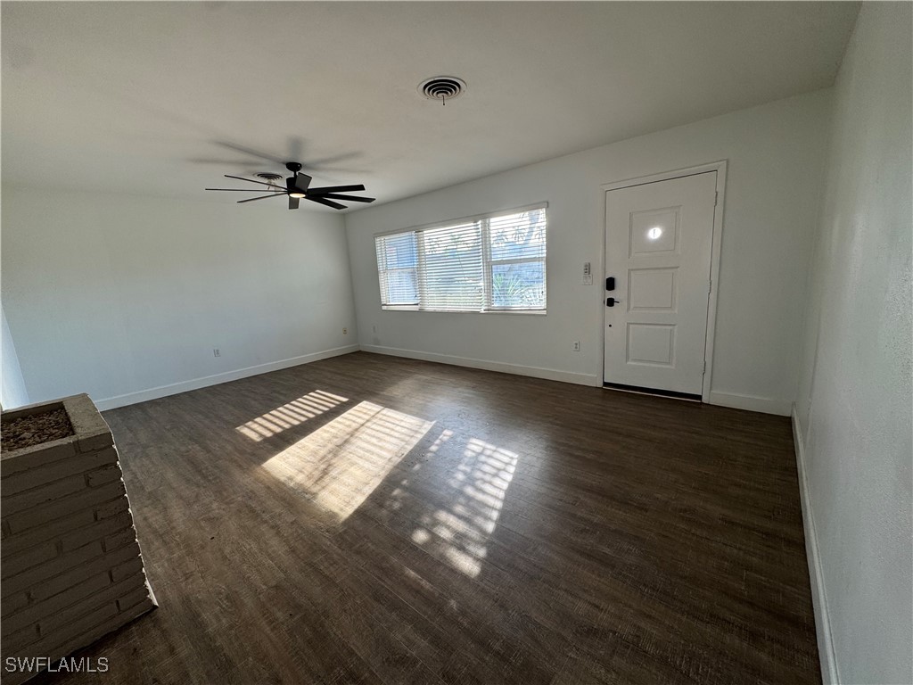 5521 Granada Road Fort Myers, FL 33919 - Photo 5 of 35 a view of empty room with wooden floor and fan