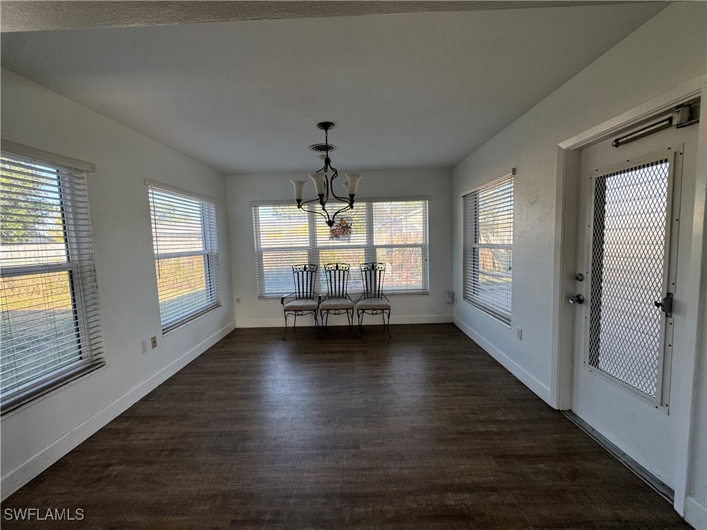 5521 Granada Road Fort Myers, FL 33919 - Photo 7 of 35 a view of empty room with wooden floor and fan
