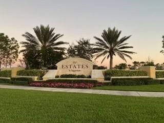 12348 Arabella Drive Port St. Lucie, FL 34987 - Photo 20 of 26 a view of a house with a yard
