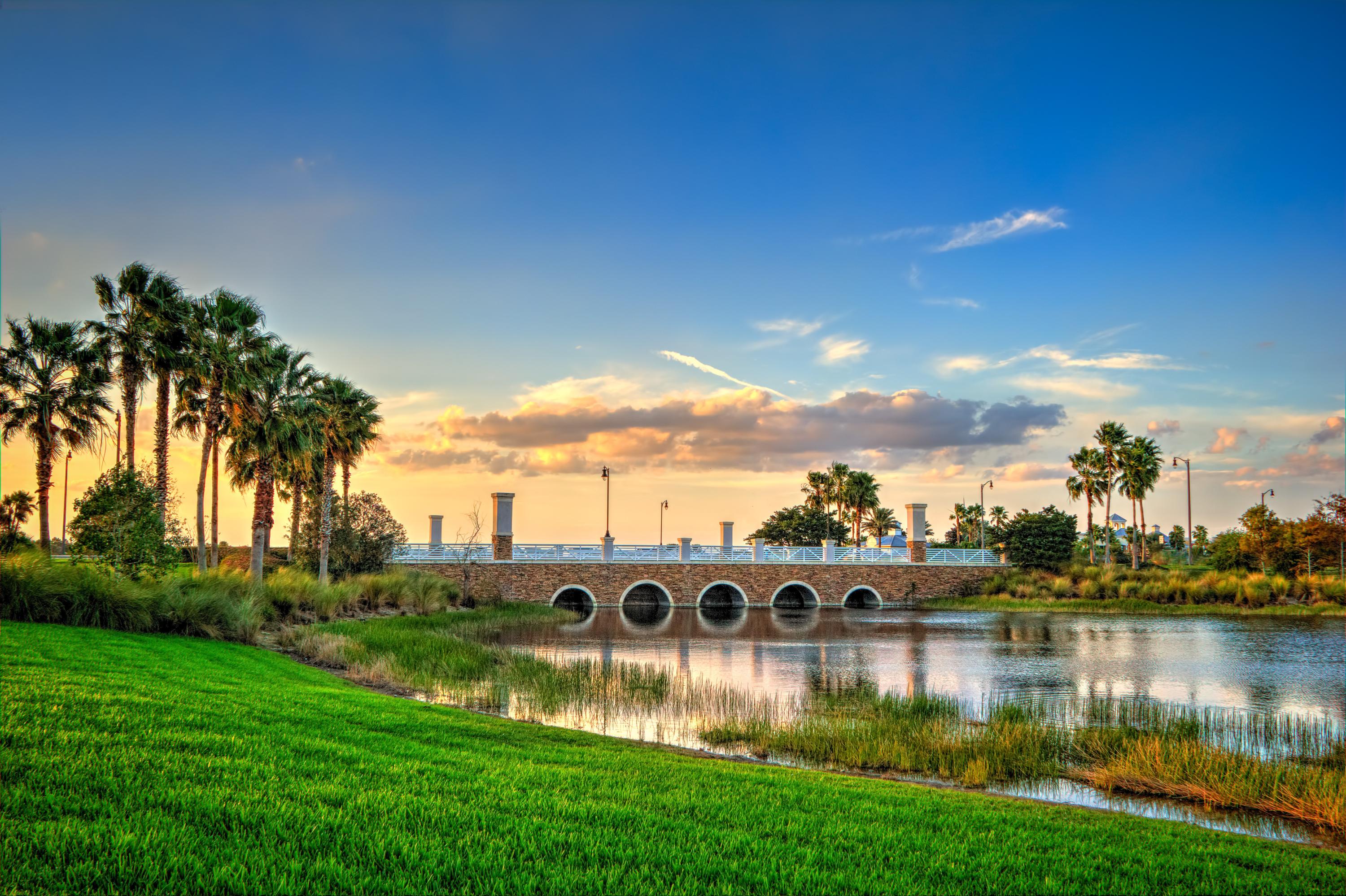12348 Arabella Drive Port St. Lucie, FL 34987 - Photo 24 of 26 a view of a lake with houses in the back